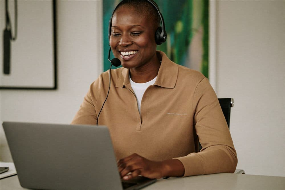 A friendly support consultant on a call